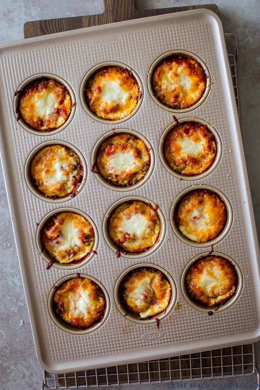 Overhead photo of a muffin pan of baked lasagna cups