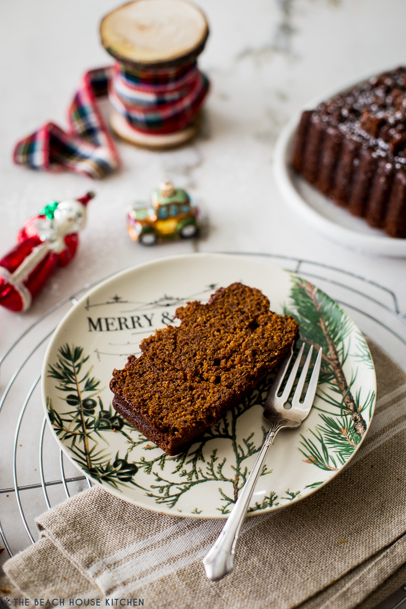 Up close photo of a slice of gingerbread cake on a plate