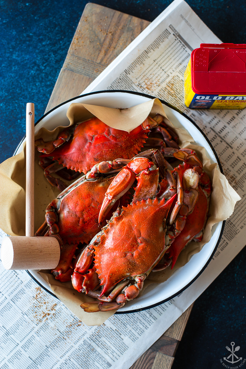 Overhead photo of a enamel pan with cooked crabs