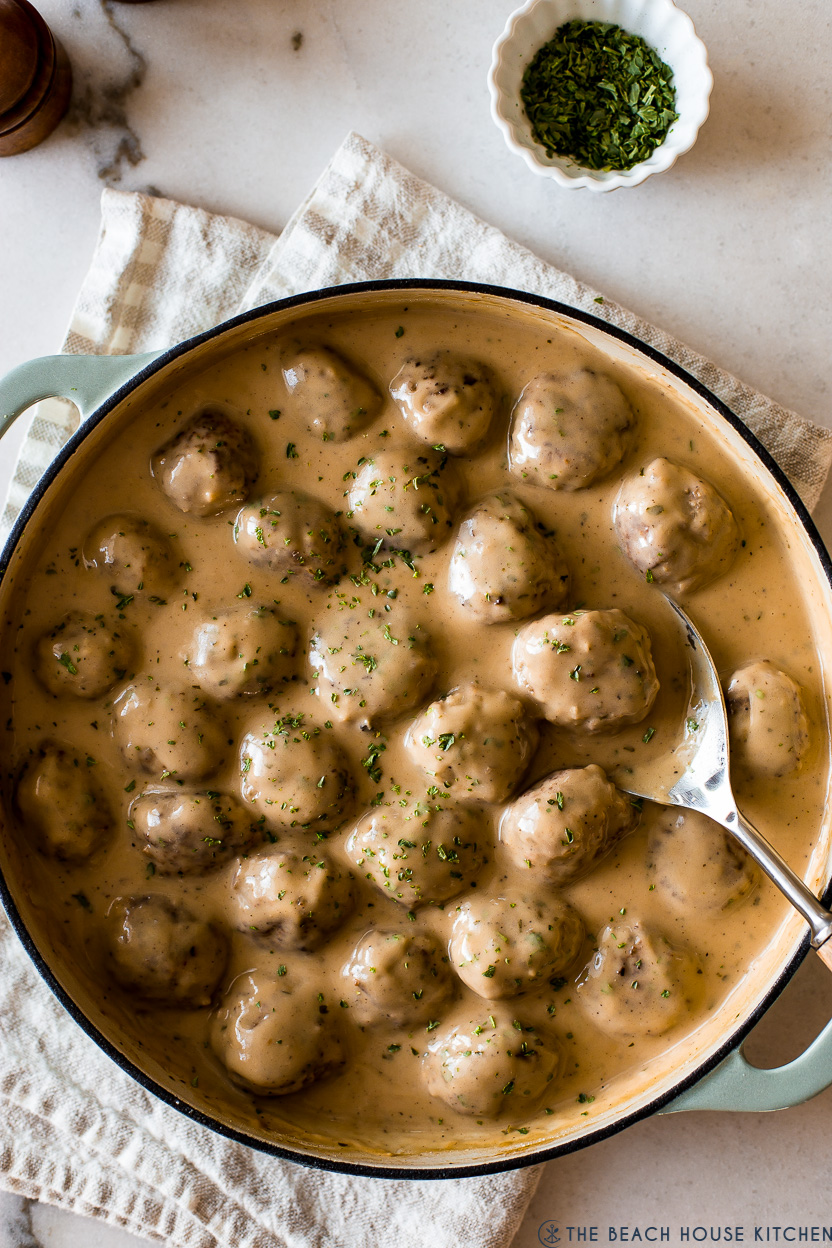 Up close overhead photo of a skillet of Swedish meatballs