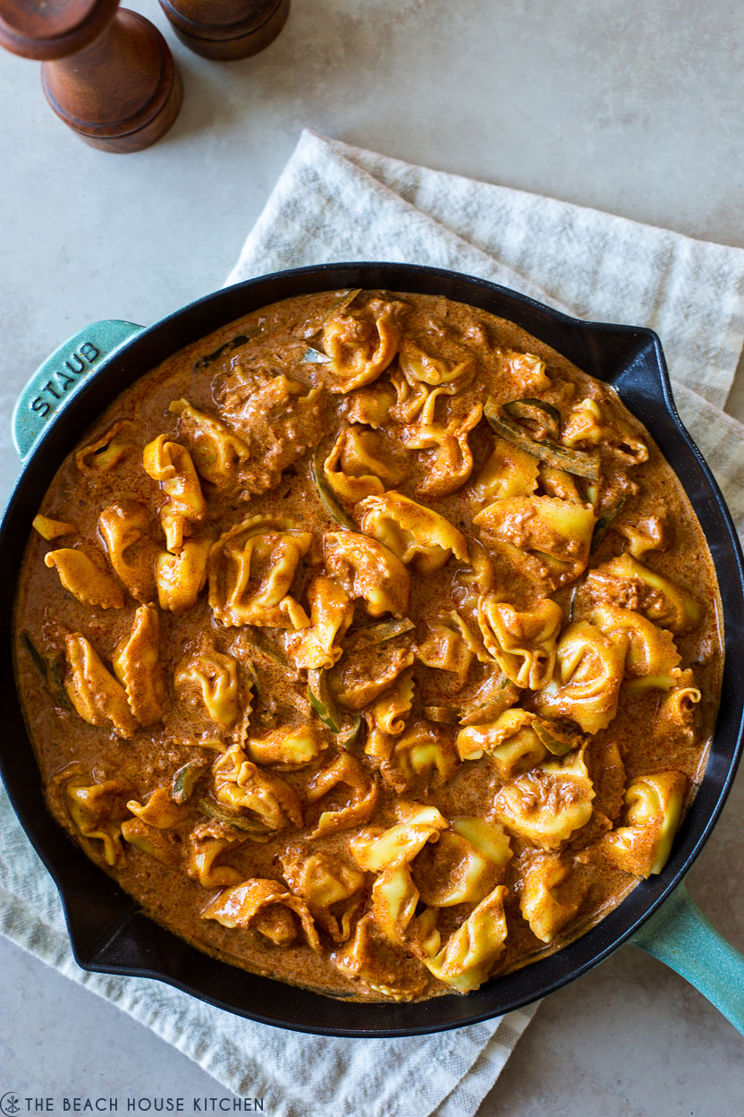 Up close overhead photo of a skillet of chicken tortellini paprikash