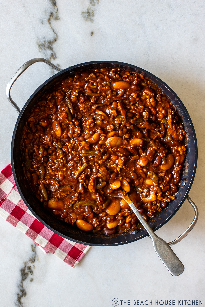 Overhead photo of a skillet filled with Italian Baked Beans