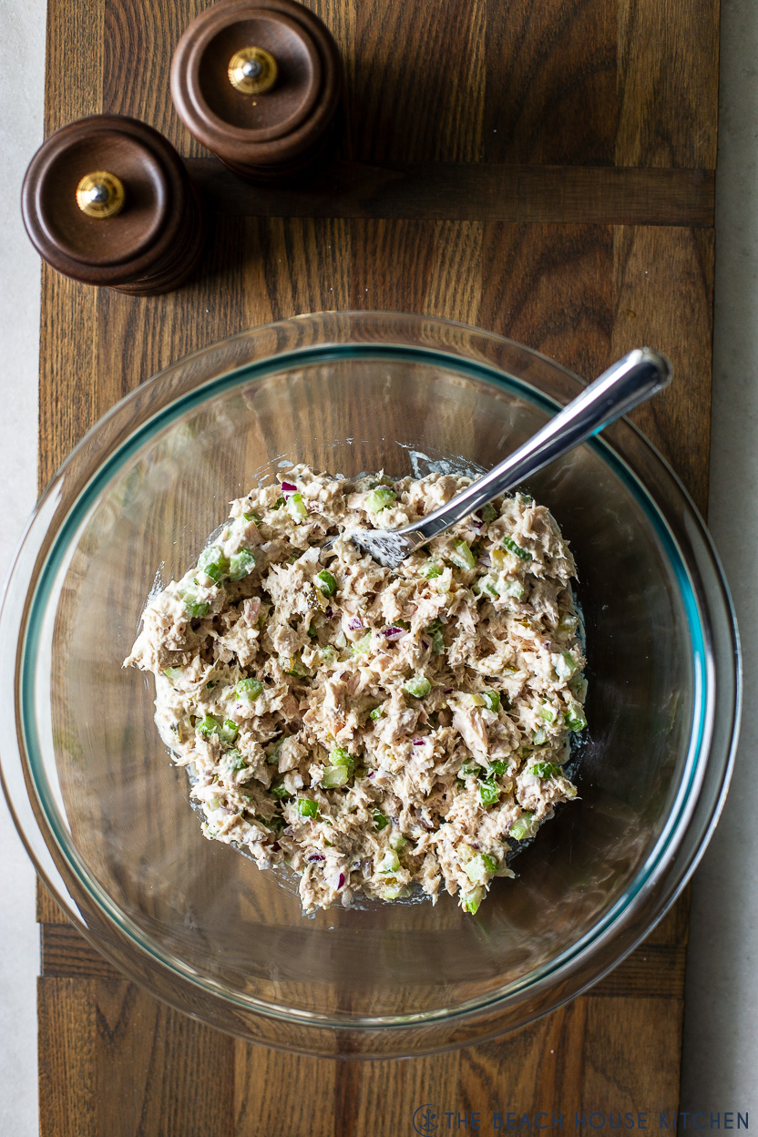 Overhead photo of a glass bowl filled with tuna salad