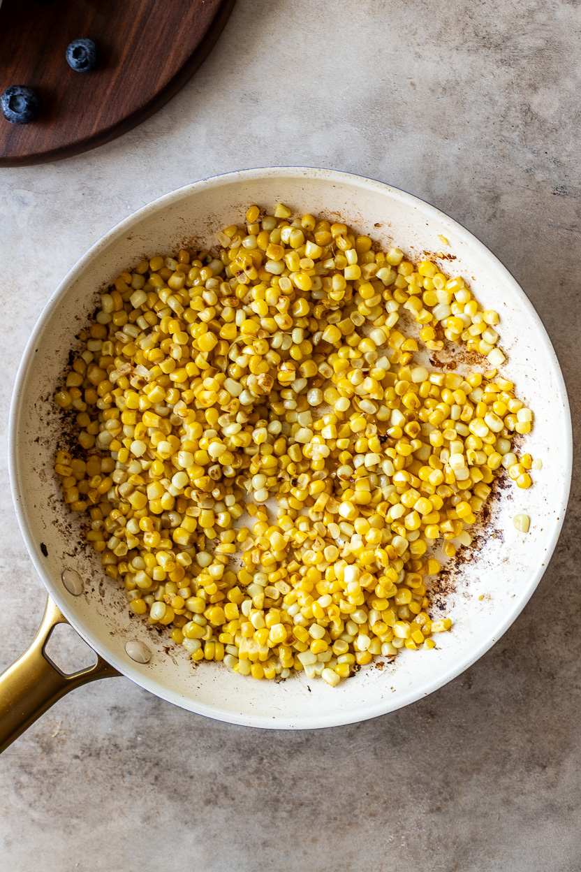 Overhead photo of a skillet of cooked corn
