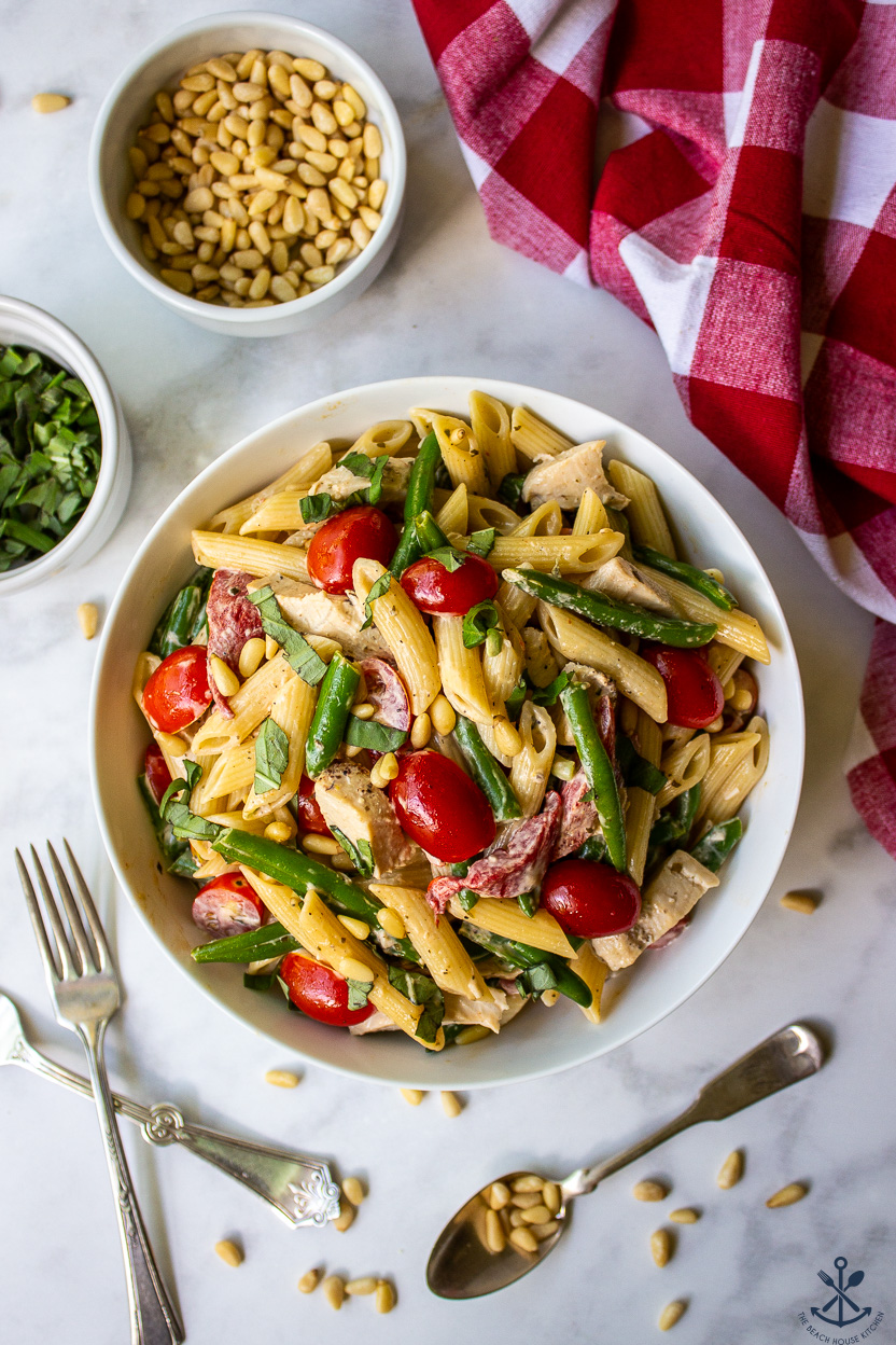 Overhead photo of a bowl of chicken pesto pasta salad