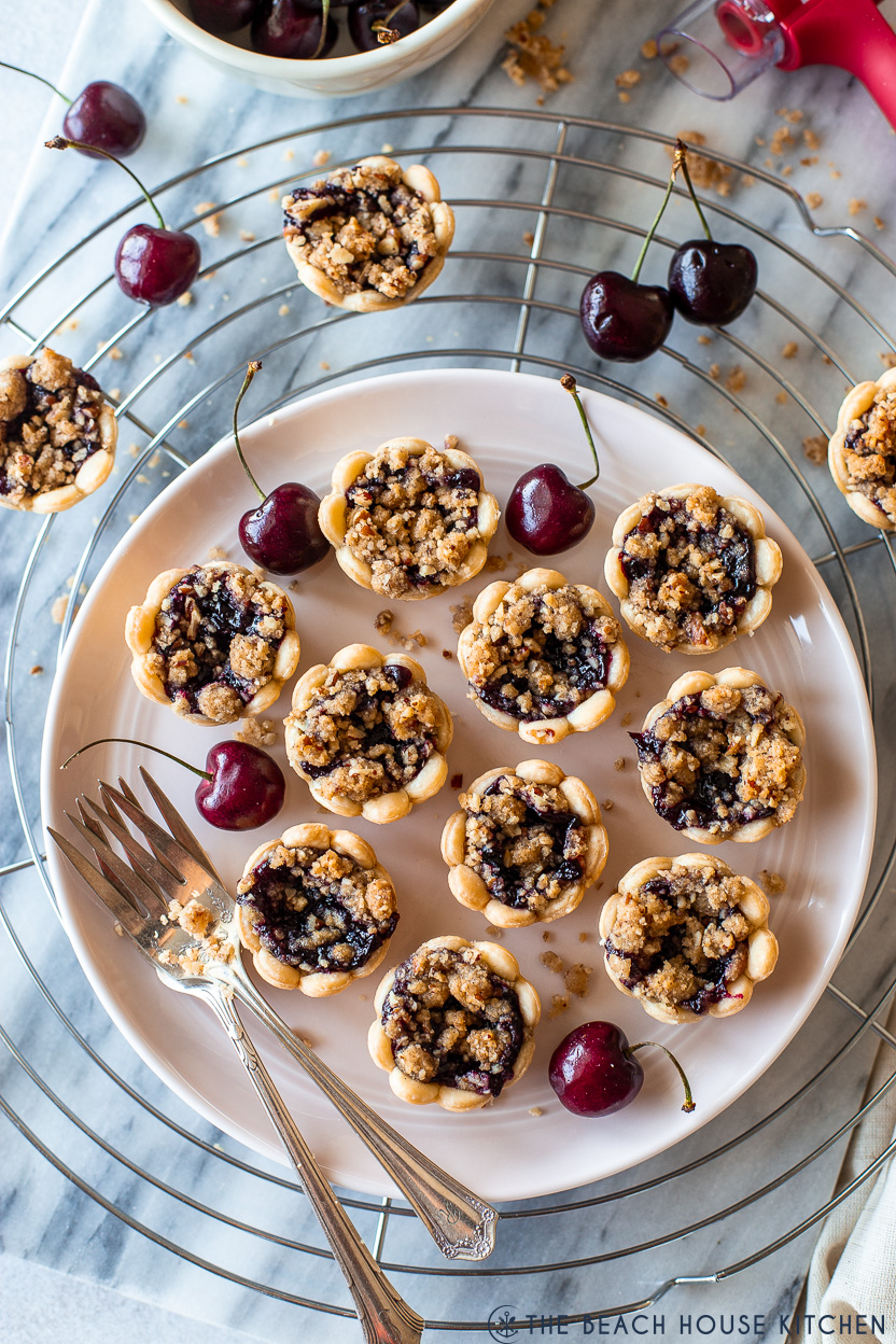 Overhead photo of a plate of streusel topped cherry pie bites