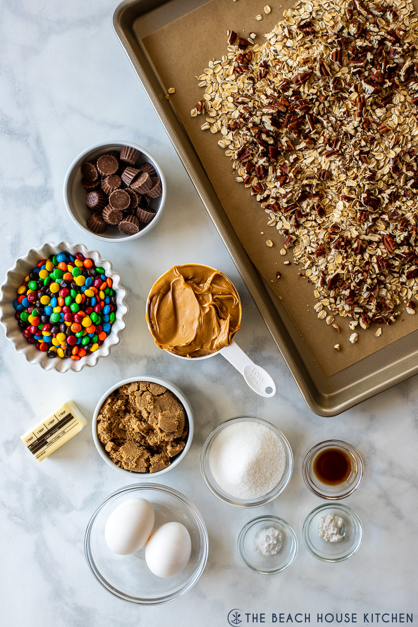 Overhead photo of ingredients for oatmeal peanut butter chocolate candy cookies