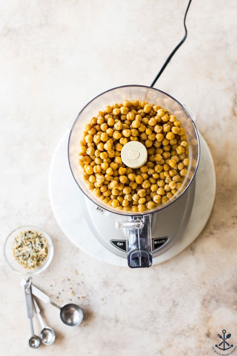 Overhead photo of a food processor filled with chickpeas