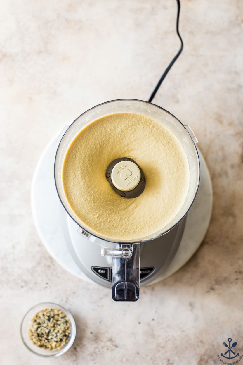 Overhead photo of a food processor of hummus