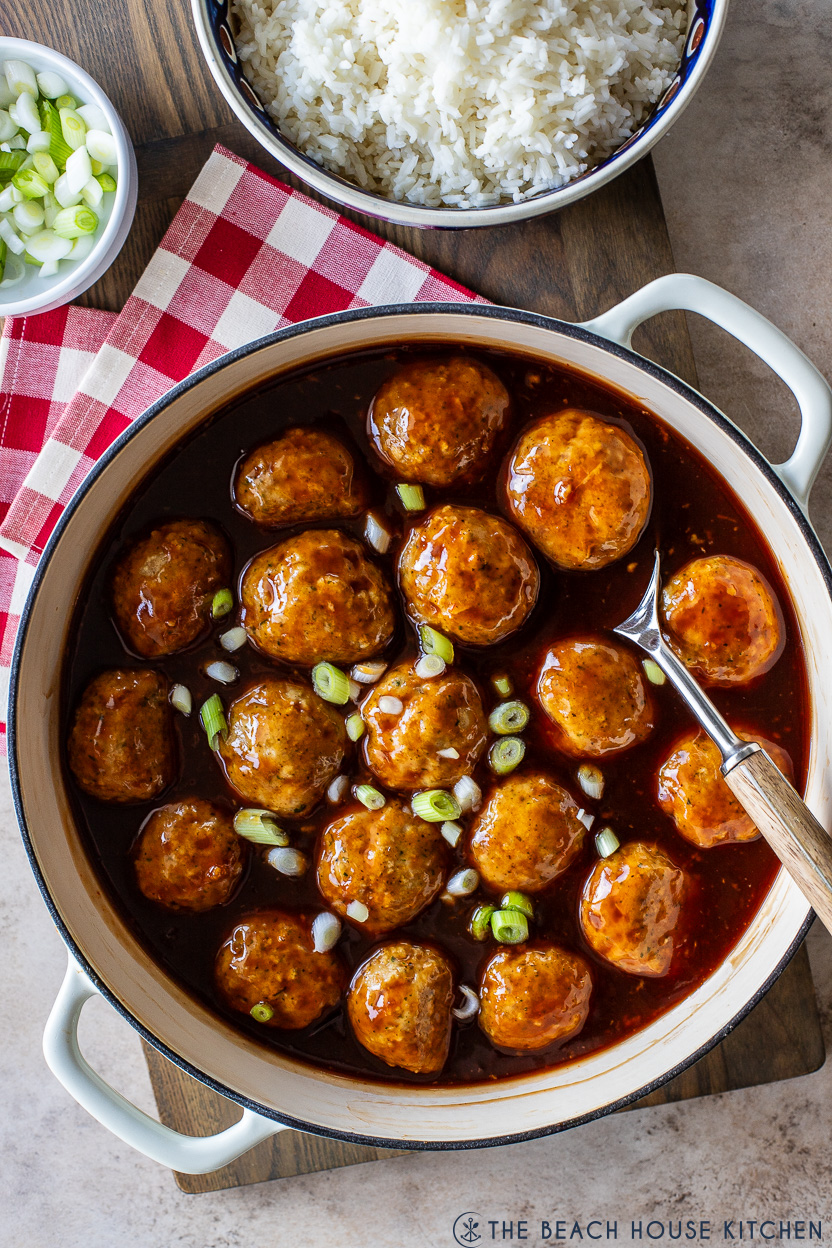 Overhead photo of a skillet of huli huli chicken meatballs