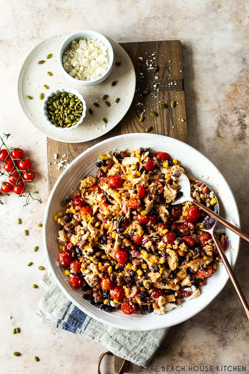 Overhead photo of a southwest chicken salad in a white platter