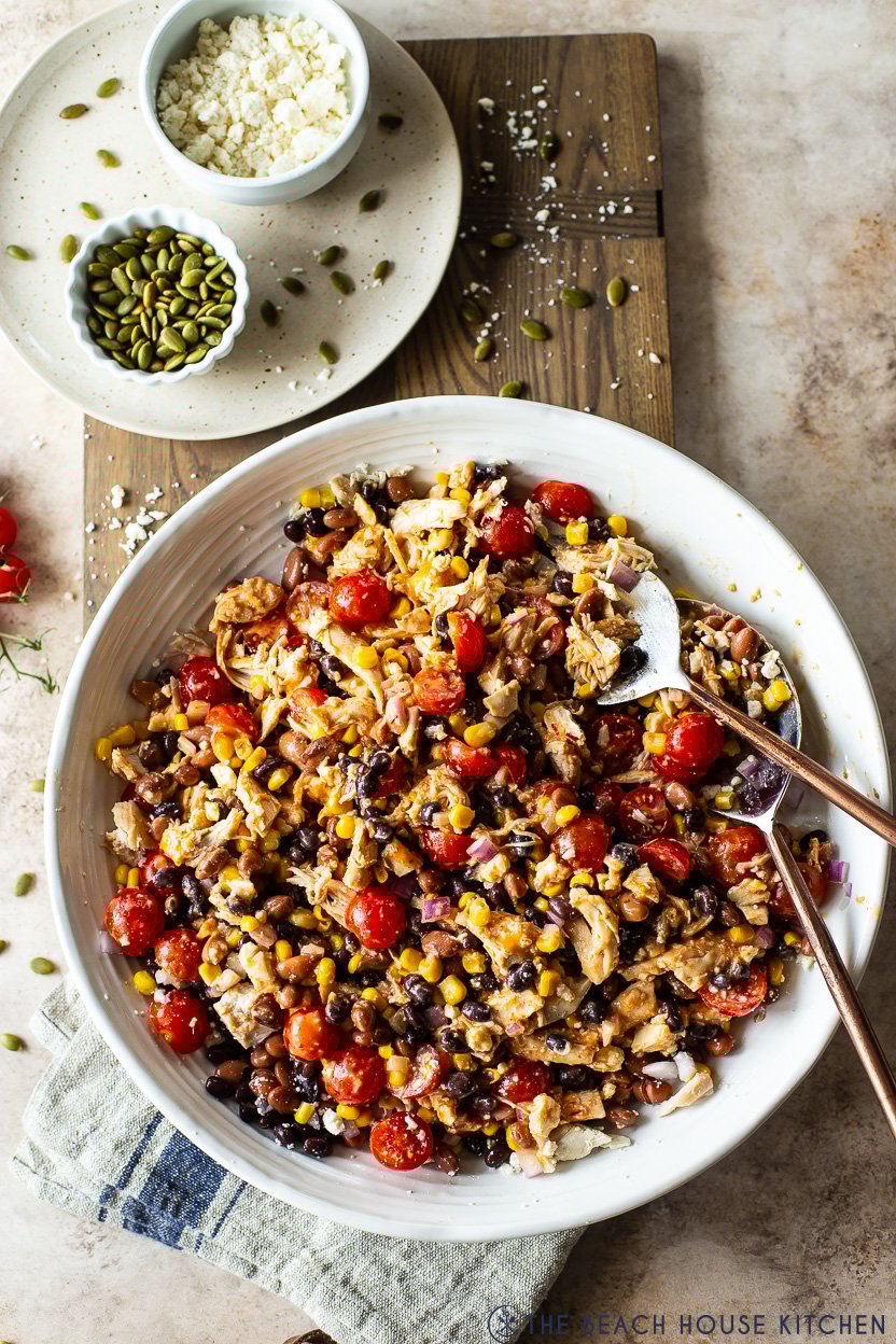 Overhead photo of a platter of southwest chicken salad with chipotle vinaigrette