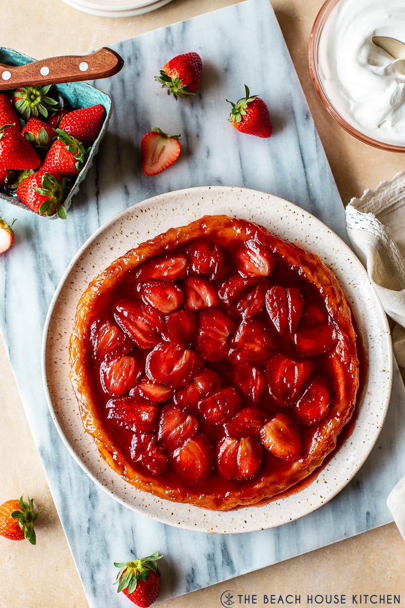 Overhead photo of a strawberry tarte tatin on a platter.