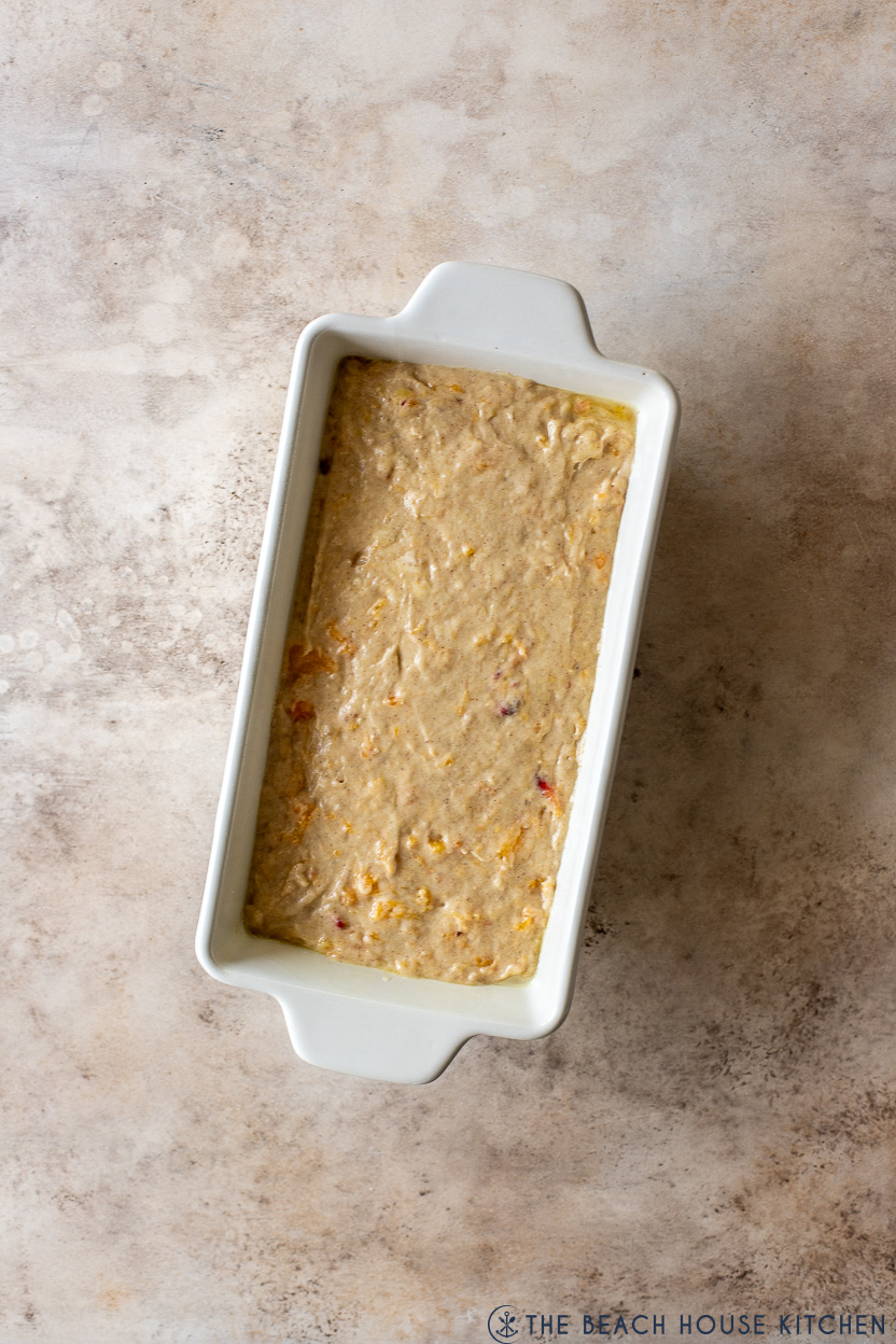 Overhead photo of a pre-baked loaf of peach bread