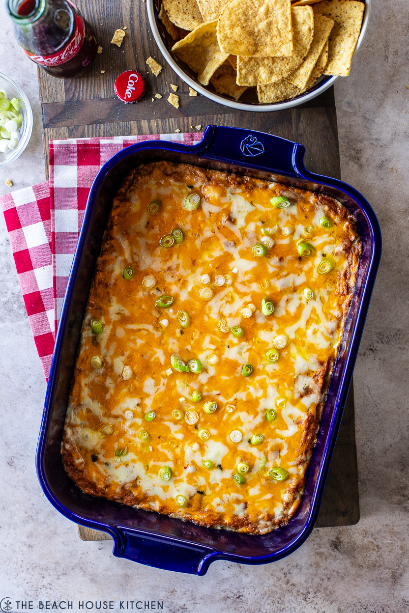 Overhead photo of a blue baking dish of Texas trash dip
