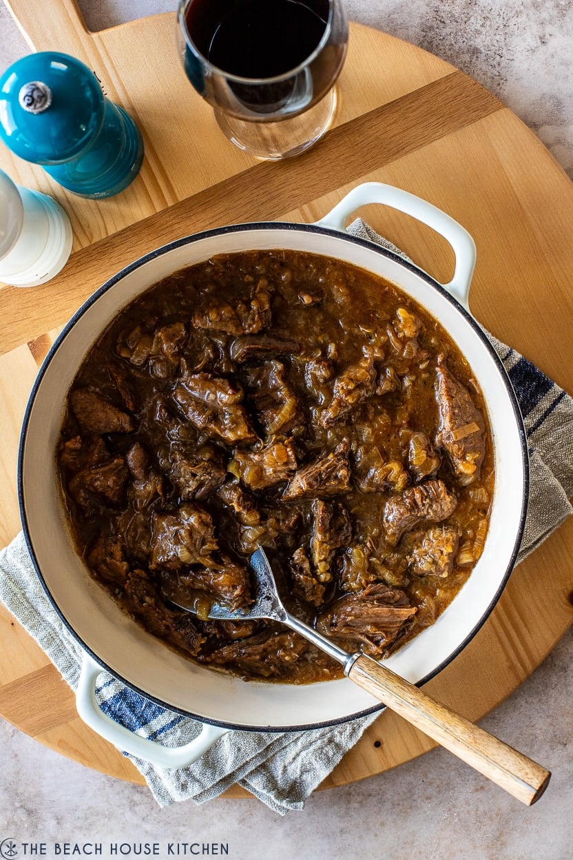 Overhead photo of a French onion pot roast in a Dutch oven