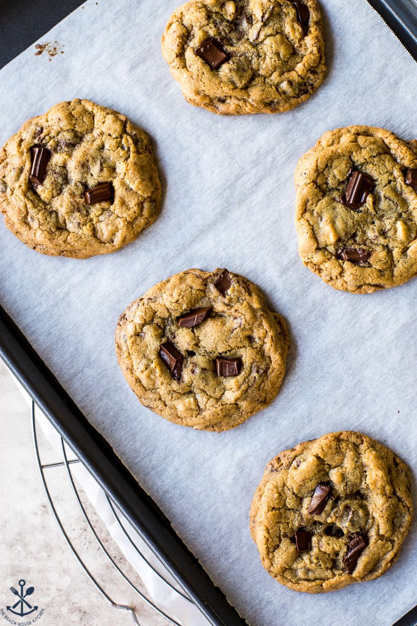 Overhead photo of chocolate chip cookies on a parchment-lined baking sheet
