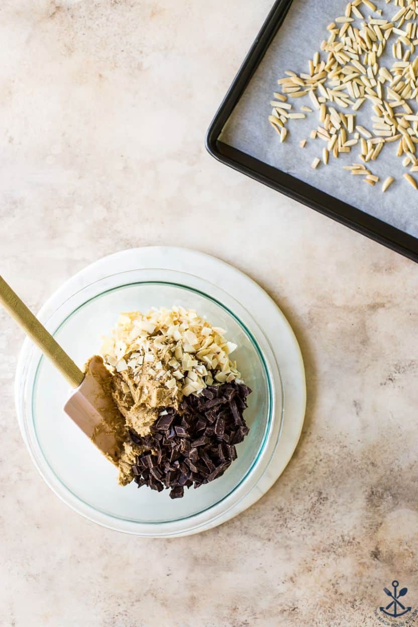 Overhead photo of a bowl filled with cookie dough, coconut and chocolate chunks