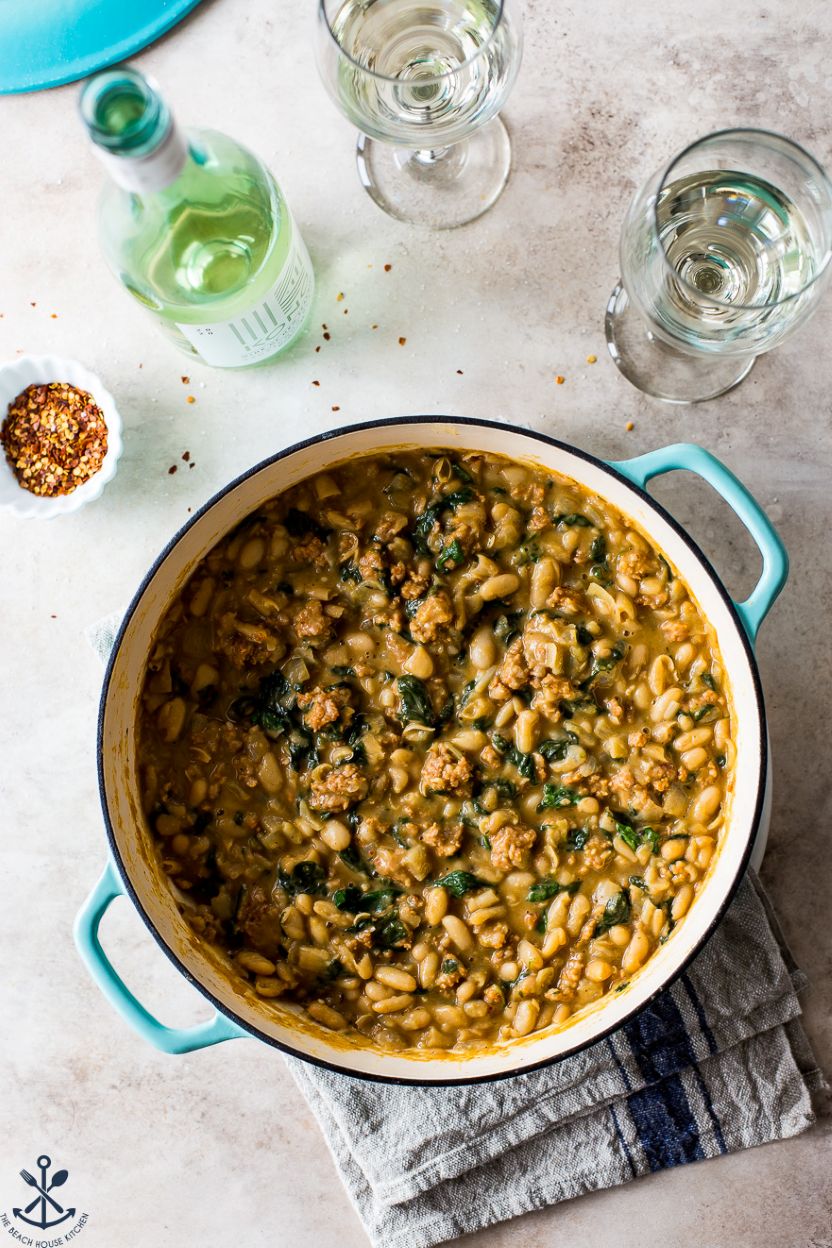 Overhead photo of a skillet of white bean chorizo stew