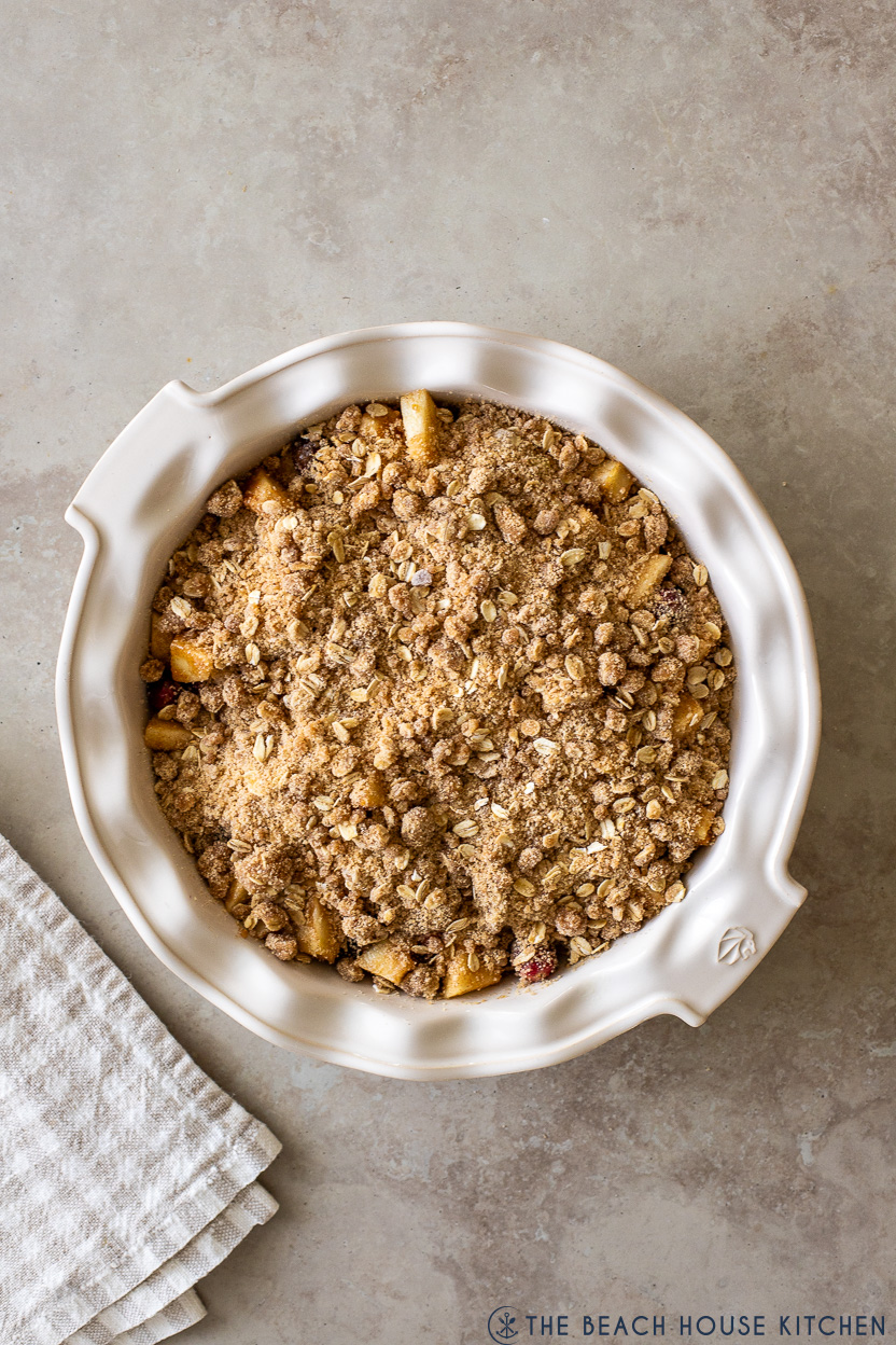 Overhead photo of a pre-baked apple cranberry crisp