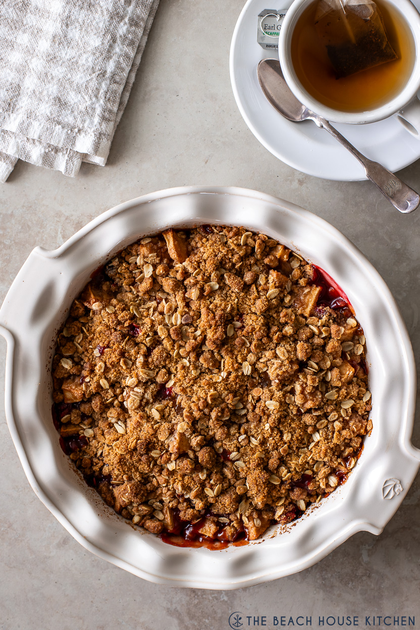 Overhead photo of a pie plate filled with Apple Cranberry Crisp