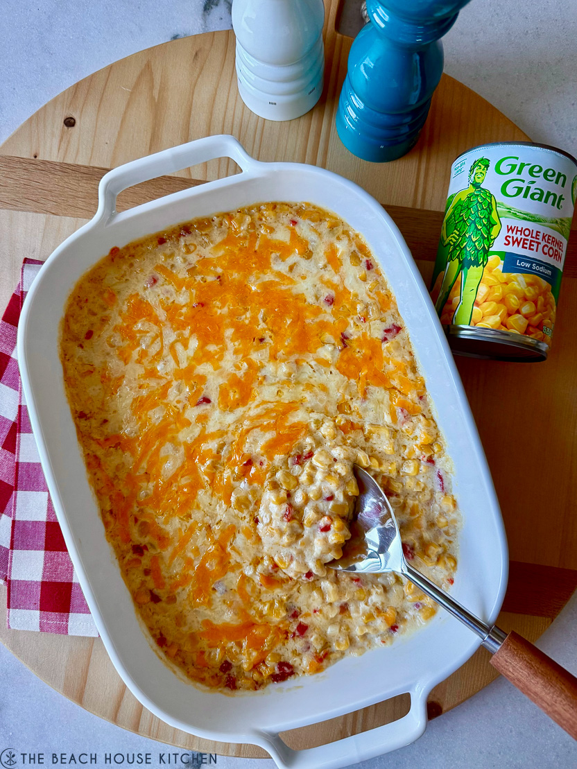 Overhead photo of a casserole dish of pimento cheese creamy corn