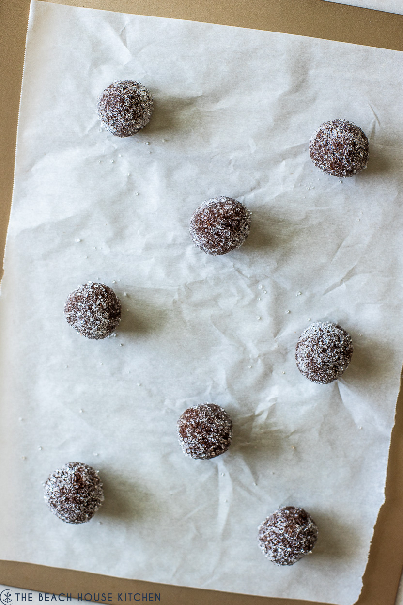 Overhead photo of a tray of pre-baked chocolate sugar cookie balls