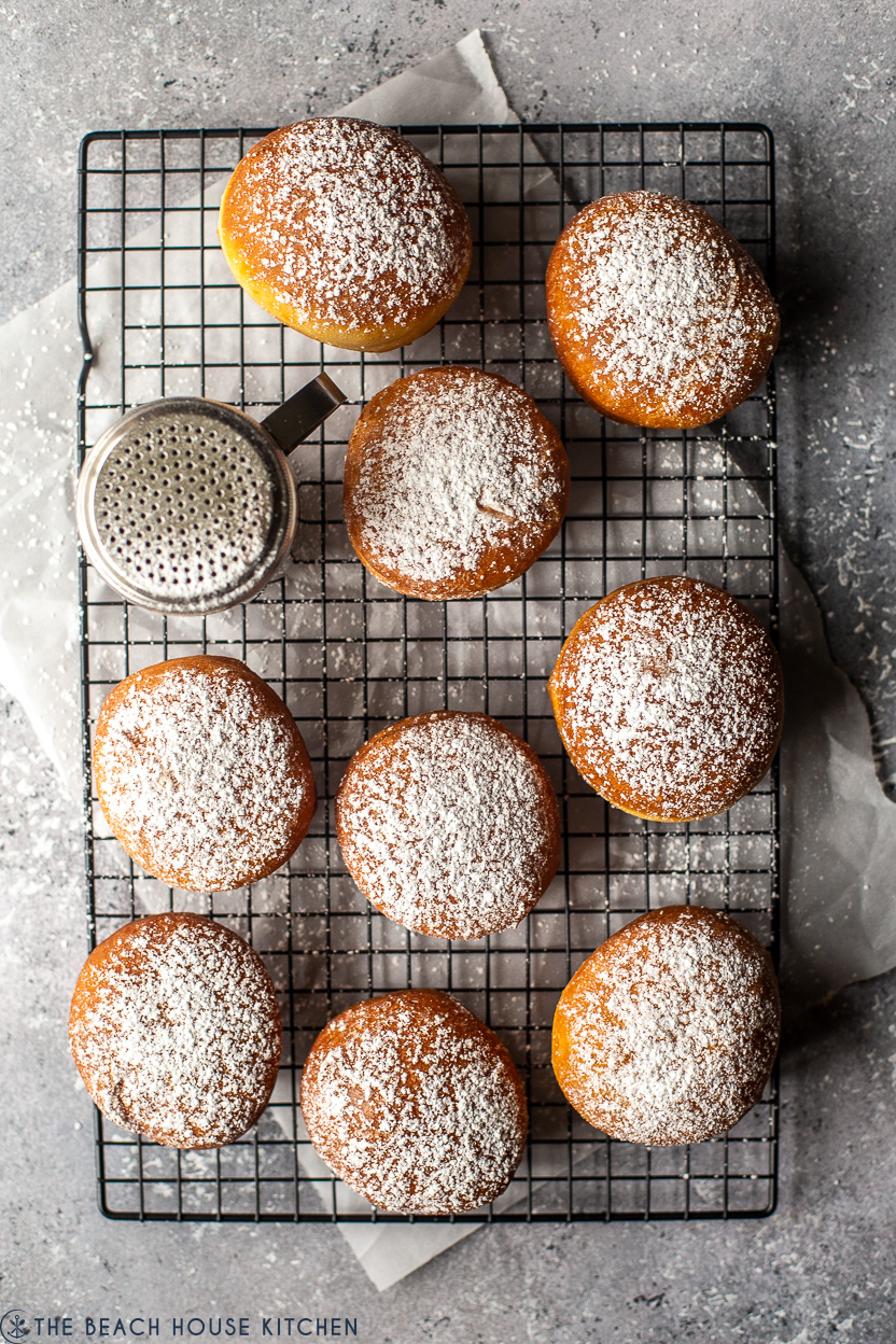 Overhead photo of a wire rack topped with Hungarian doughnuts