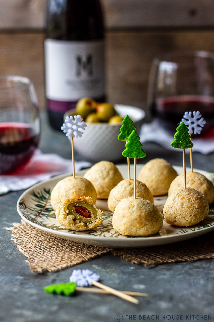 A plate of olive balls with holiday picks