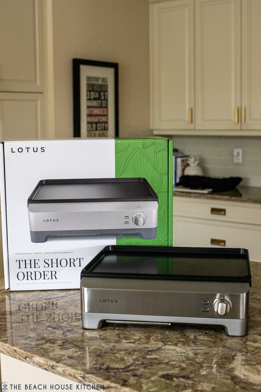 Photo of a Lotus griddle and packaging behind it