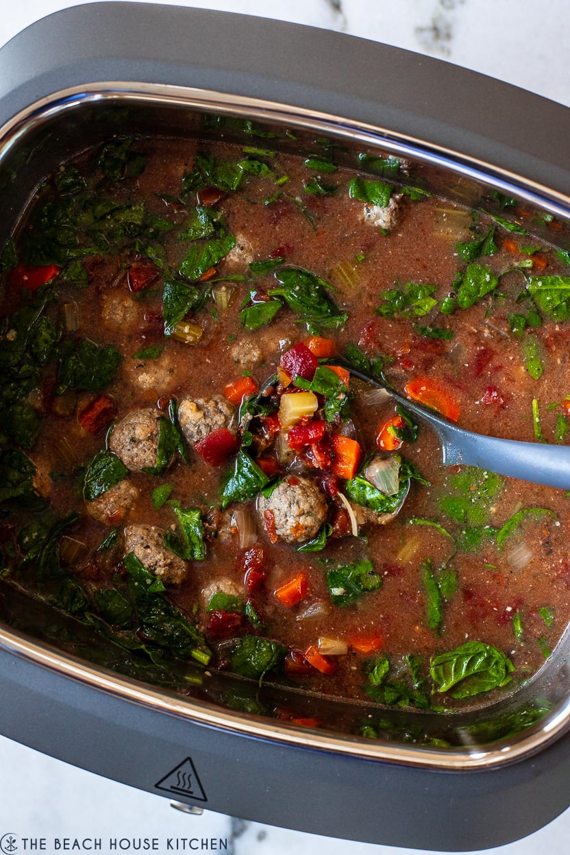 Up close overhead photo of a slow cooker of Italian Meatball Soup