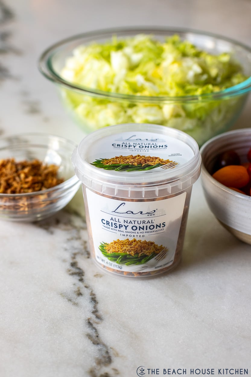 Up close photo of a container of crispy onions