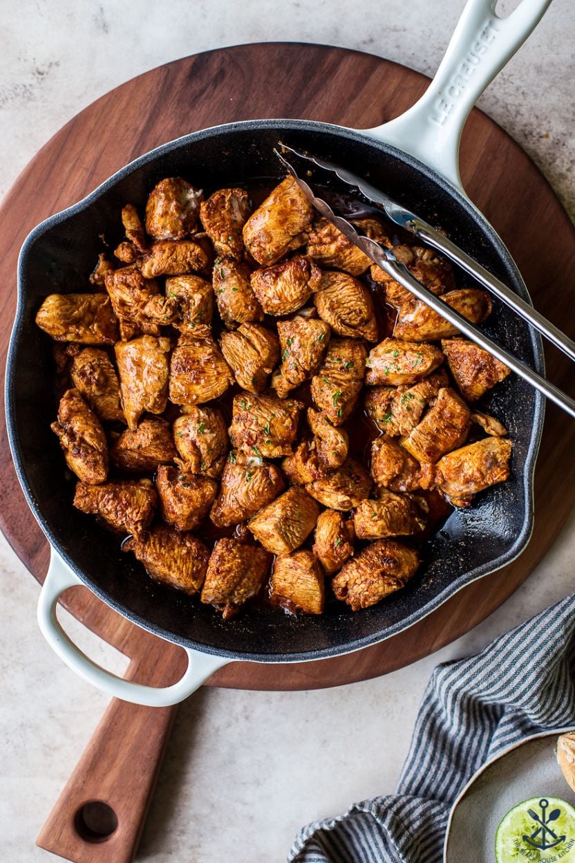 Up close overhead photo of a skillet of Mexican Spiced Chicken Bites
