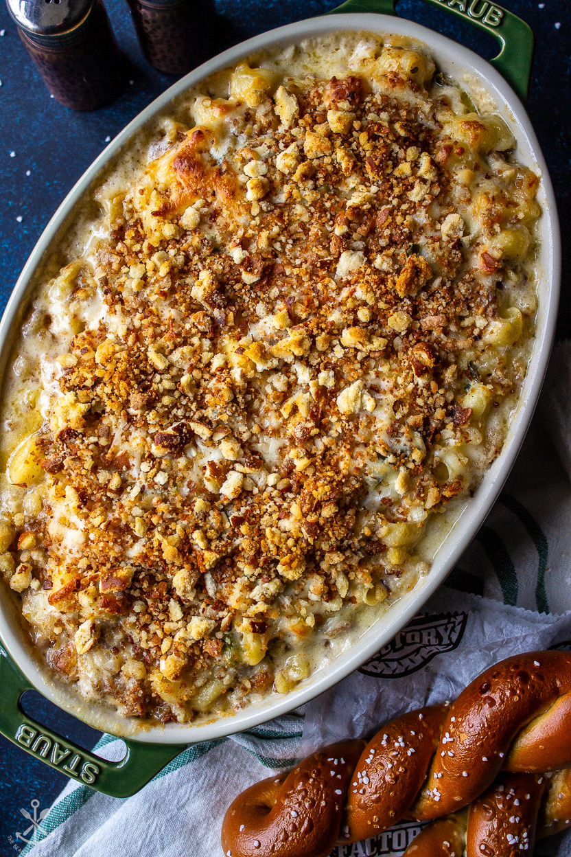 Up close overhead photo of Philly Cheesesteak Macaroni and cheese in an oval baking dish