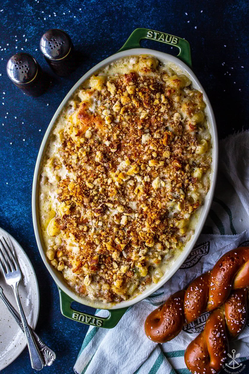 Overhead photo of an oval baking dish filled with Philly Cheesesteak Macaroni and Cheese