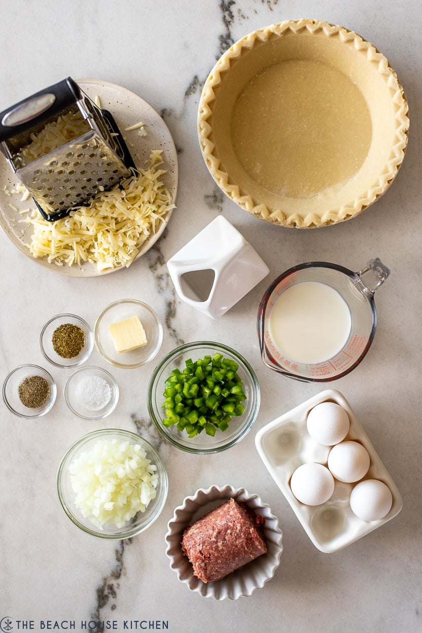 Overhead photo of ingredients for sausage pepper and onion quiche