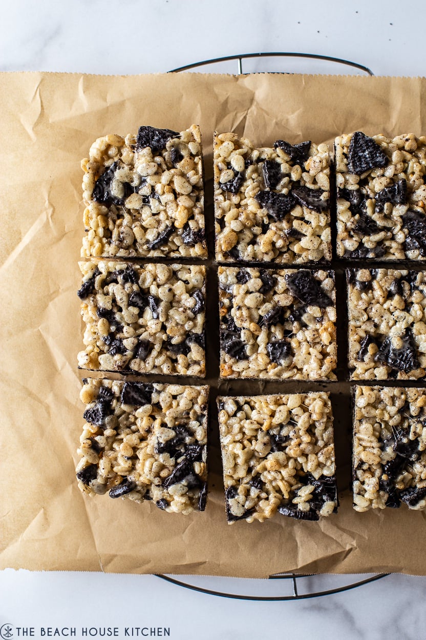 Up close overhead photo of Oreo rice krispie treats on light brown parchment paper