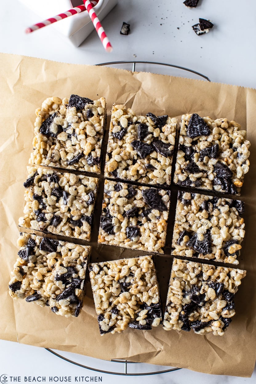 Up close overhead photo of 9 oreo rice krispie treats on a piece of tan parchment paper