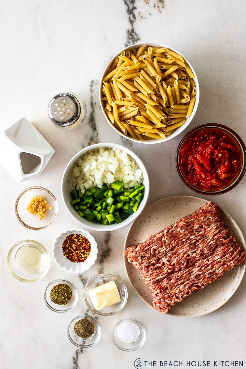 Overhead photo of ingredients for Penne with Italian Sausage Tomatoes Peppers and Onions