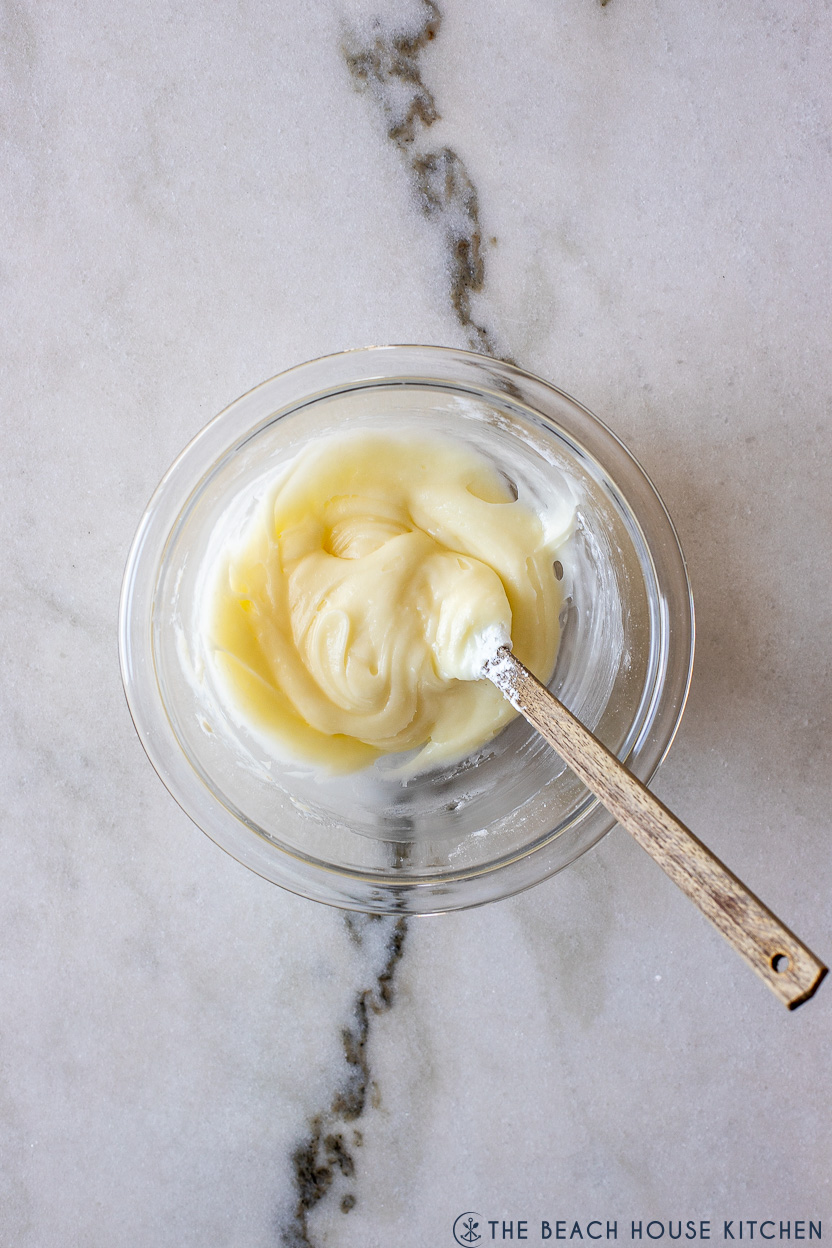 Overhead photo of a bowl of cream cheese glaze